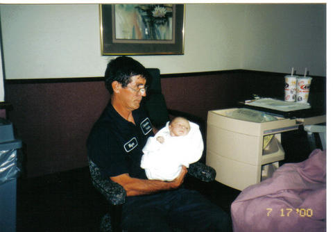 Papa Wayne holding Nick on the first day he was born